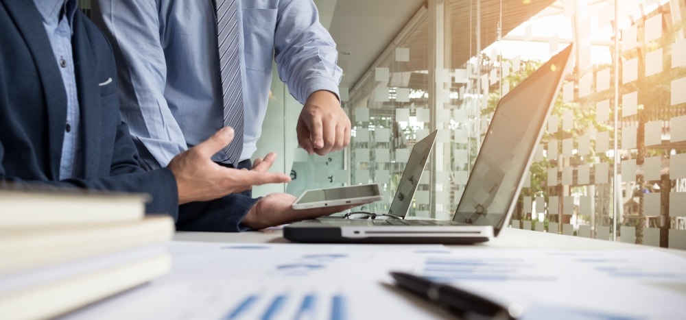 business adviser analyzing financial figures denoting progress work company